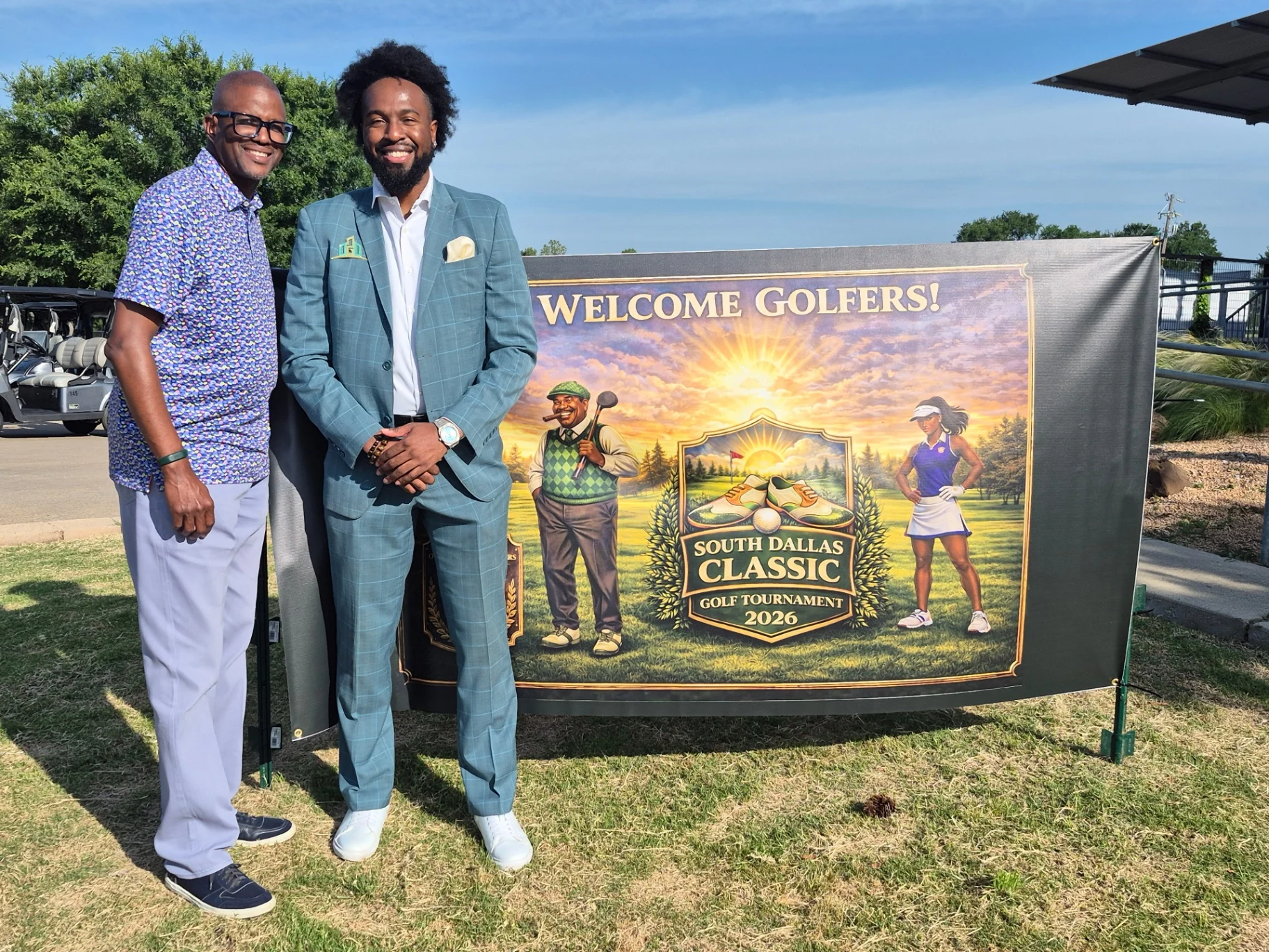 Corey Artis with a partner in front of the South Dallas Classic Golf Tournament 2026 welcome banner