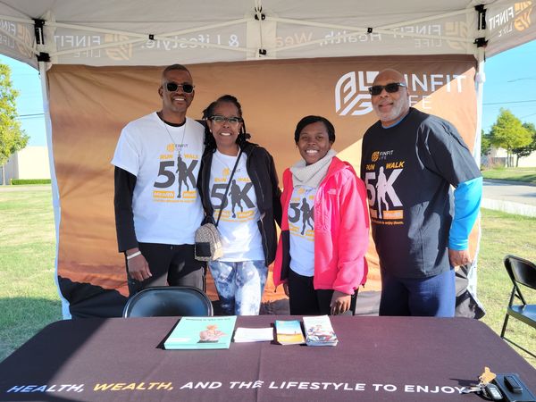 FinFit Life Run/Walk 5K team at the event tent welcoming participants
